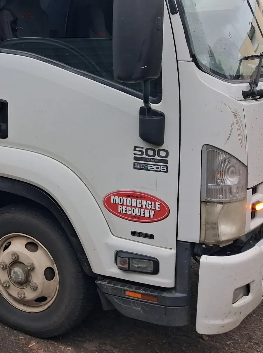 The Motorcycle Recovery sticker on the door of A.R Towing's Isuzu